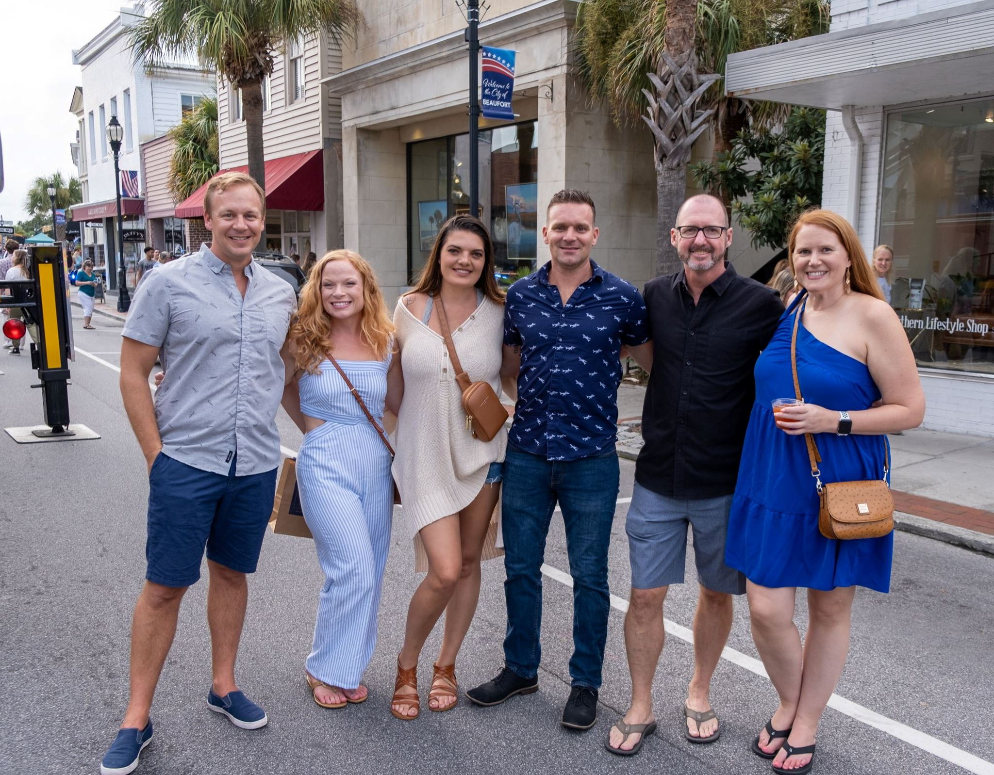 First Friday event Sept. 2022 shows people posing for photo